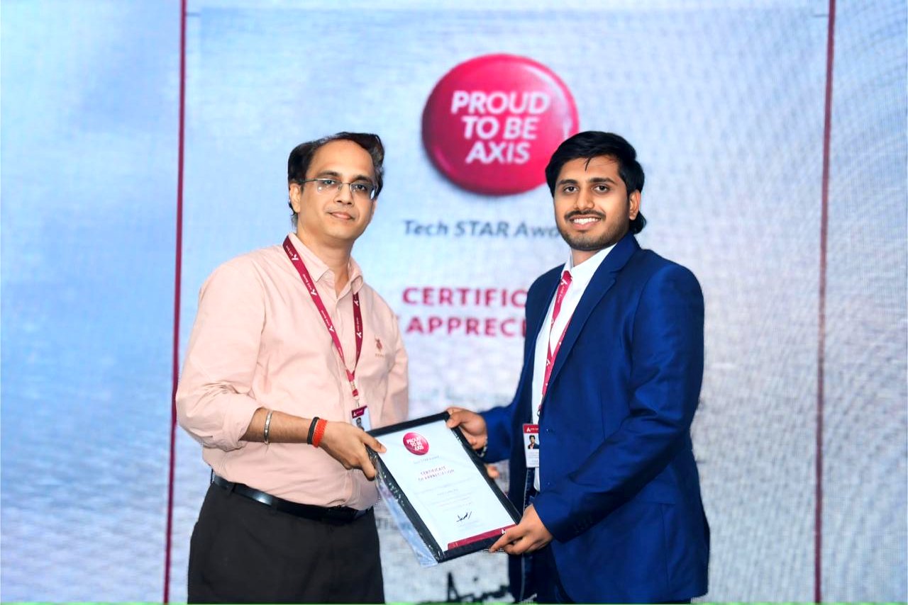 Akhil Raj Vadde receiving the Tech STAR Award certificate of appreciation at Axis Bank